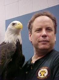 Man holding eagle freedom and jeff dispenser amenities