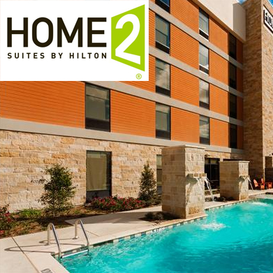 home2 suites by hilton frisco as seen from outside by pool dispenser amenities