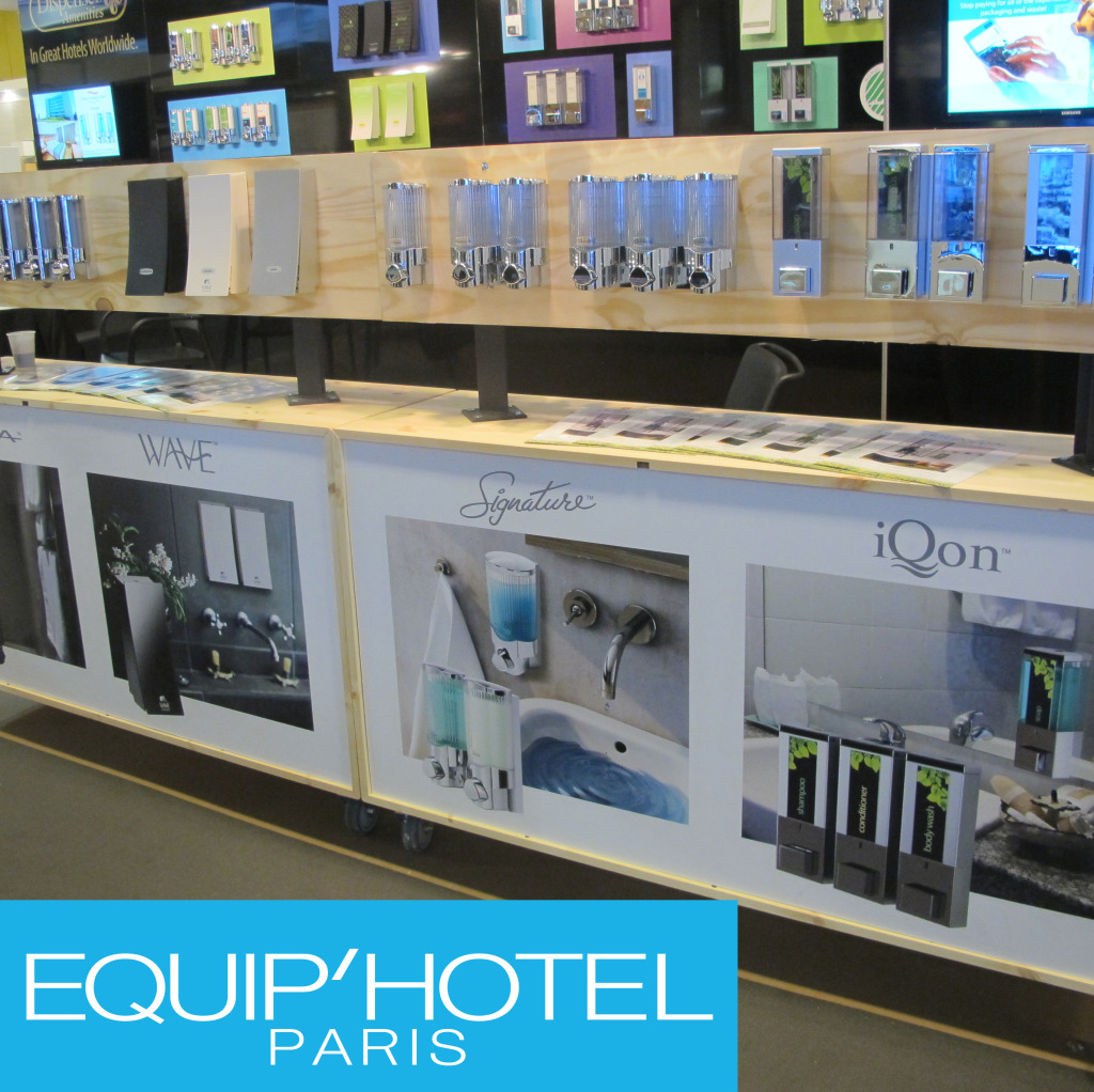 Wall full of dispensers on display wave signature iqon equip'hotel paris trade show dispenser amenities