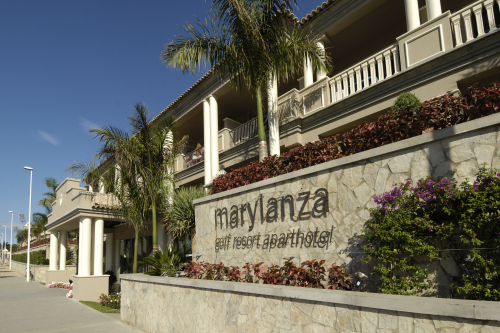 Hotel with many columns and palm trees marylanza golf resort hotel dispenser amenities